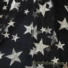 Silver Foil Stars on 2-Way Stretch Black Mesh Fabric