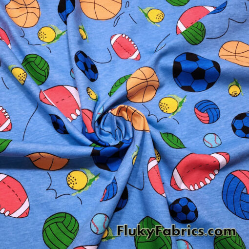 Sport Balls On a Blue Background Cotton Jersey Fabric