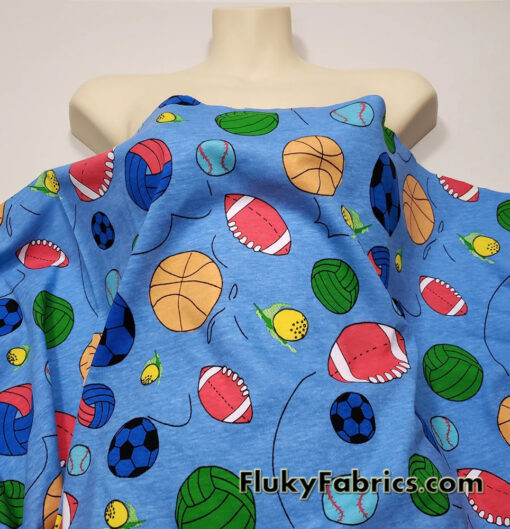 Sport Balls On a Blue Background Cotton Jersey Fabric
