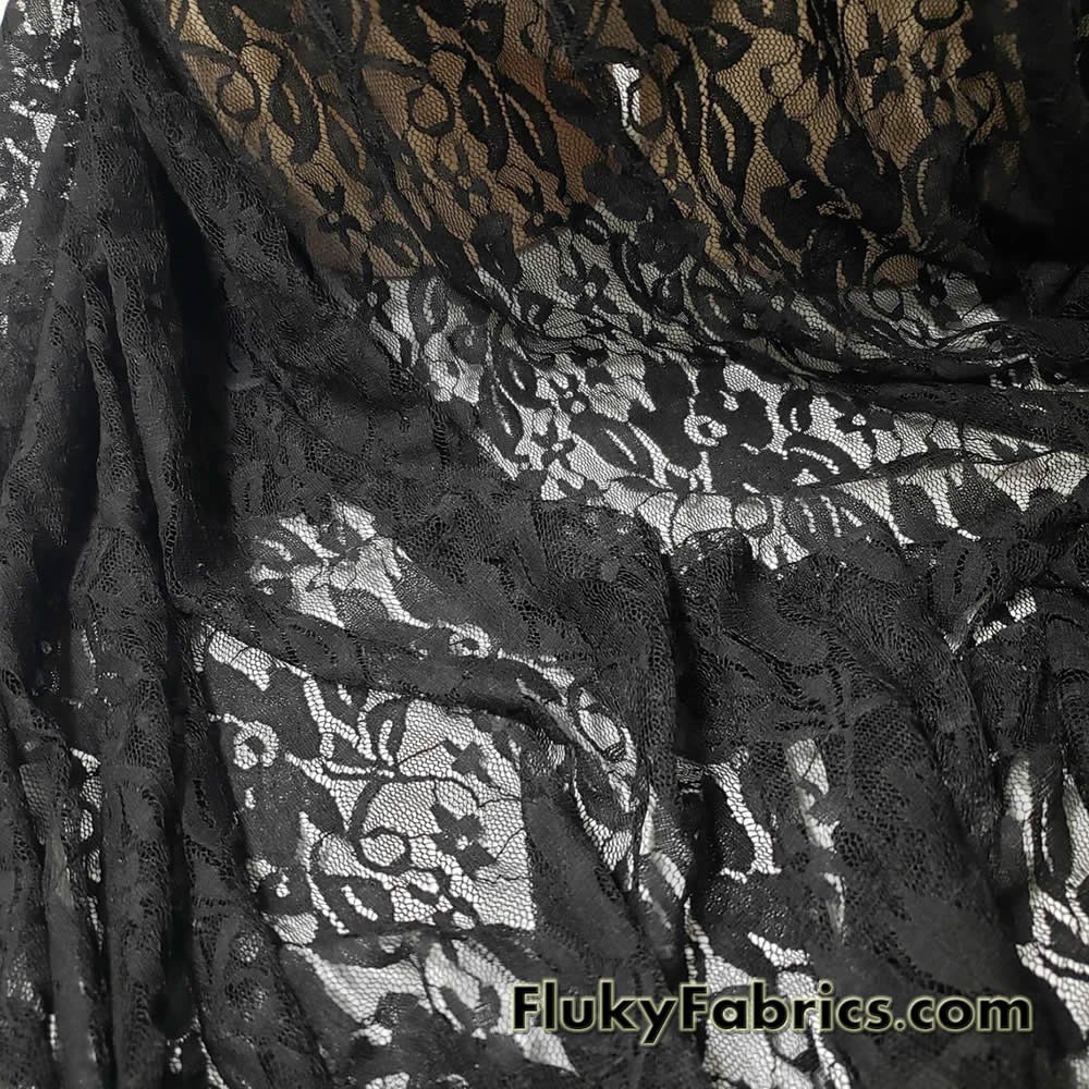 https://www.flukyfabrics.com/wp-content/uploads/2023/01/Floral-Pattern-on-Black-Stretch-Lace-Fabric-by-the-Yard-at-flukyfabrics.com-5.jpg