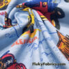 Cartoon Construction Trucks on Blue Cotton Rib Fabric