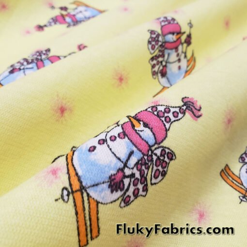 Winter Themed Vintage Cotton Rib Knit Fabric – Skiing Snowmen on Pastel Yellow