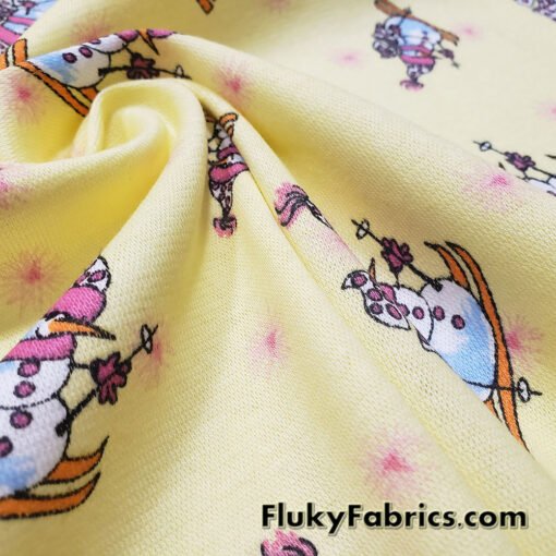 Winter Themed Vintage Cotton Rib Knit Fabric – Skiing Snowmen on Pastel Yellow