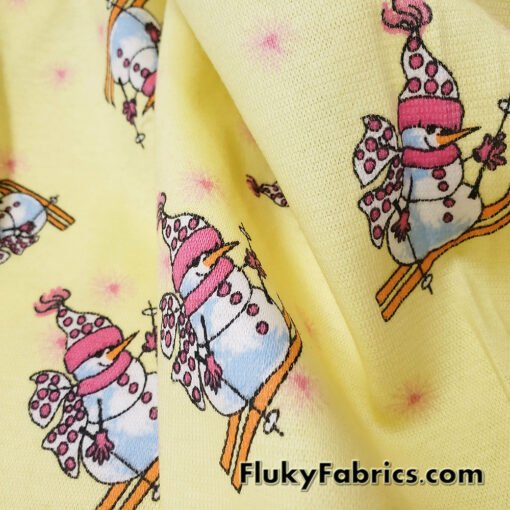Winter Themed Vintage Cotton Rib Knit Fabric – Skiing Snowmen on Pastel Yellow