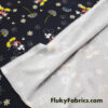 Cartoon Extravaganza on Black – Liverpool Knit Fabric for Adorable Creations