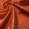 Rich Orange Imitation Latex Fabric – Glossy Liquid Look with 4-Way Stretch